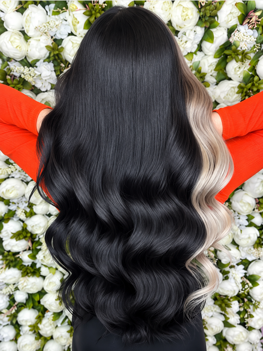 Black and platinum blonde hair extensions styled in contrasting sections 